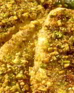 Дорада в фисташковой корочке с мангольдом, аренной ветчиной, сыром горгонзола и кедровыми орешками